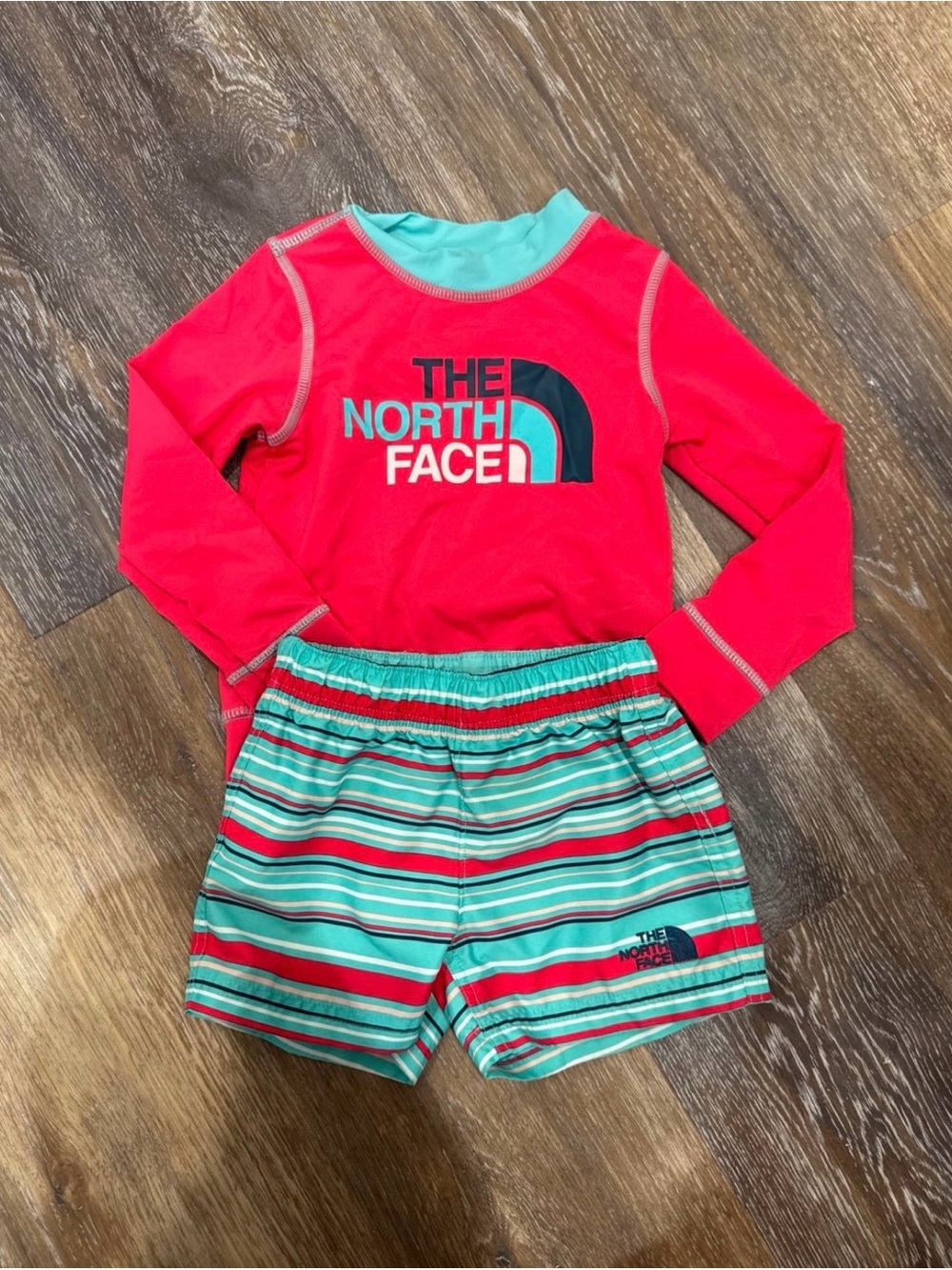 The North Face Kids pink Rashguard with Teal & pink Striped Swim Shorts